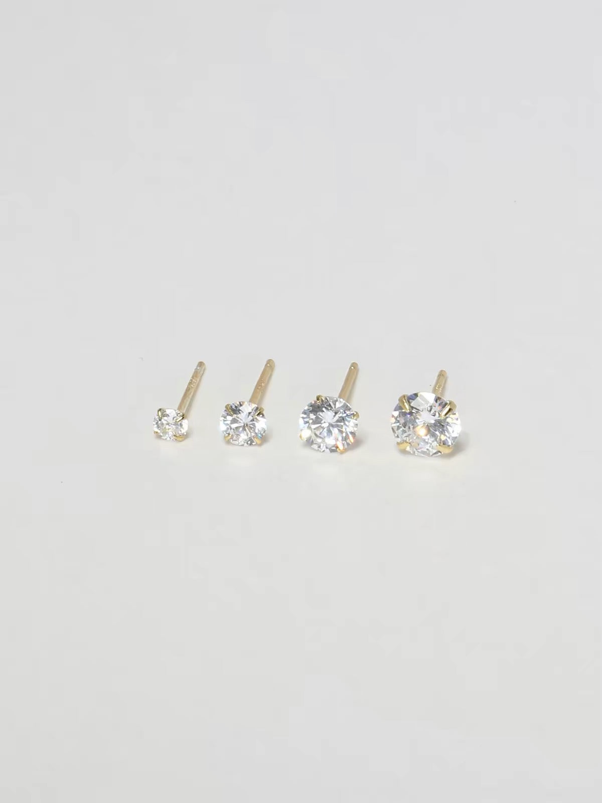 Solitaire stud earrings size range