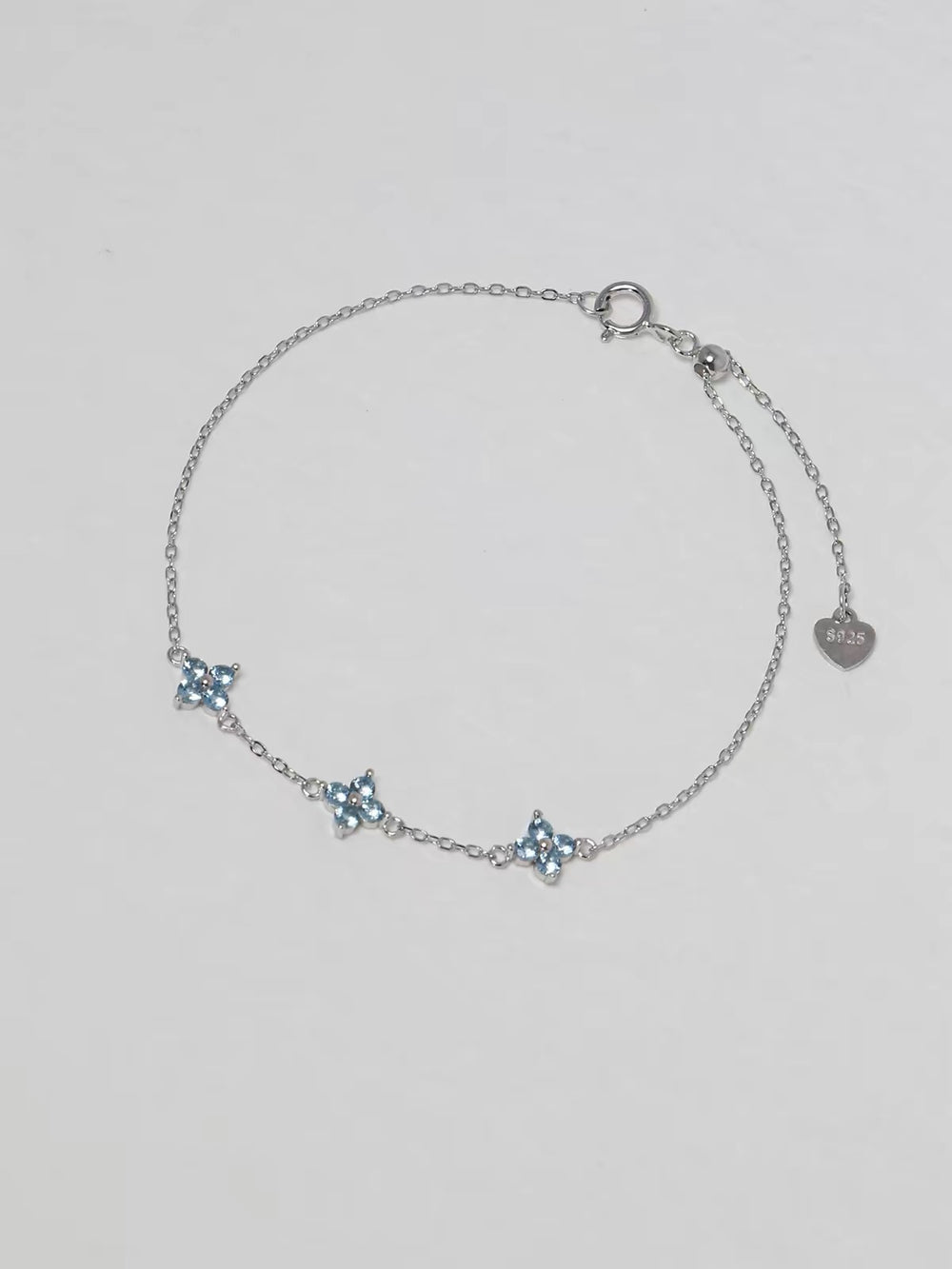 Clover Bracelet in silver with three pale blue four-petal floral stones