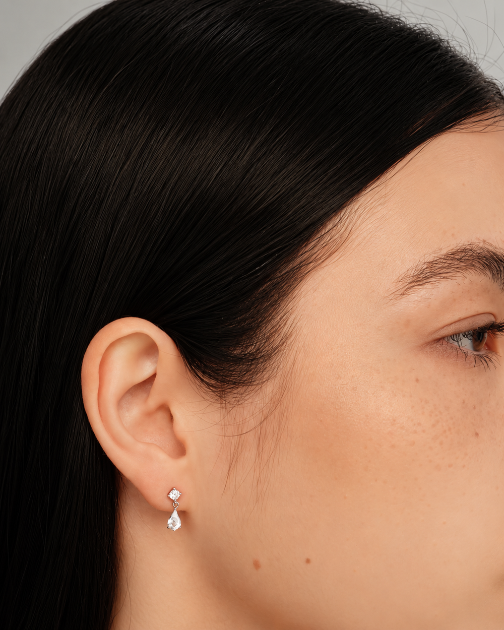 Pear drop earrings on model