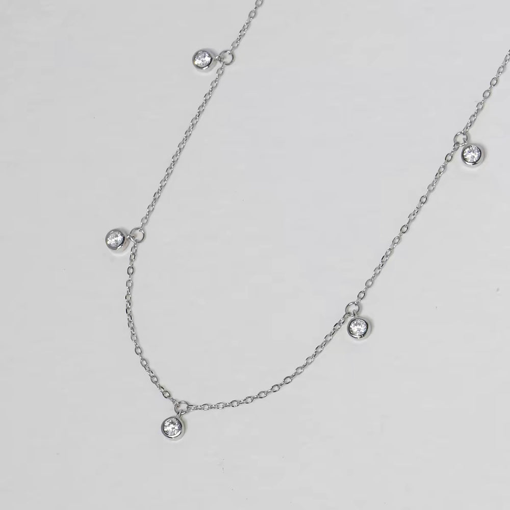 Pluie de Lumière Necklace in silver with five bezel-set zirconia drops